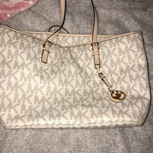 Michael Kors white and tan Jet Set bag.
